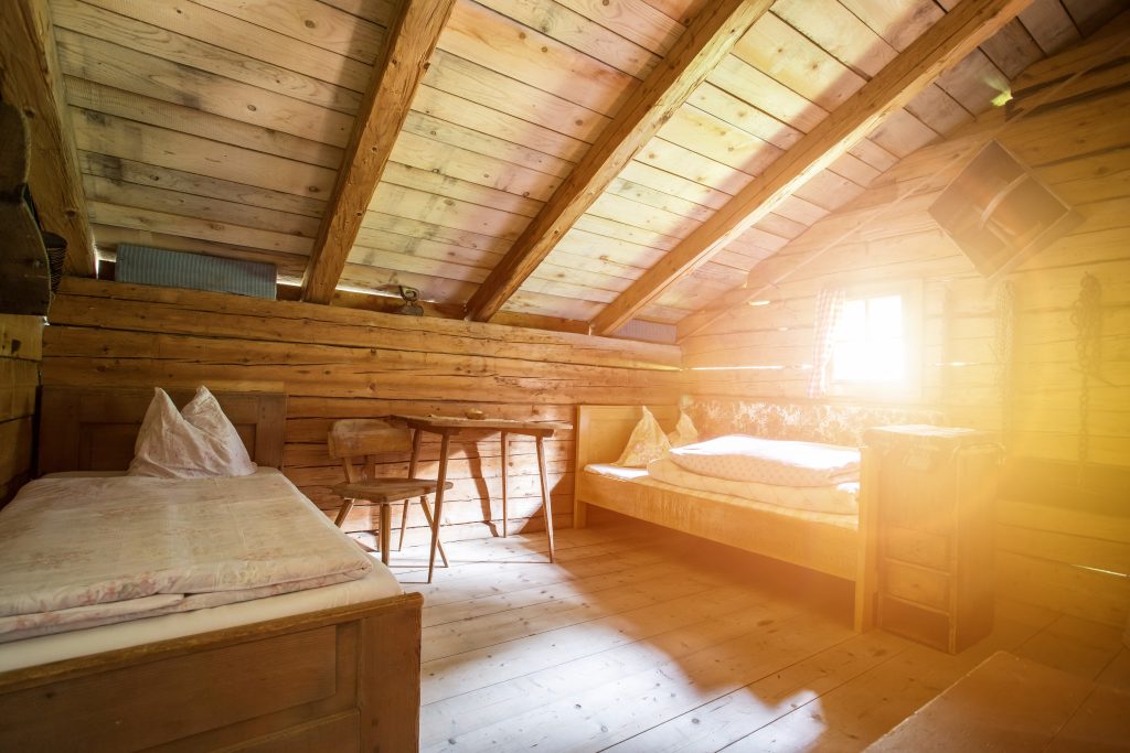 Holiday in the mountains: Rustic old wooden interior of a cabin